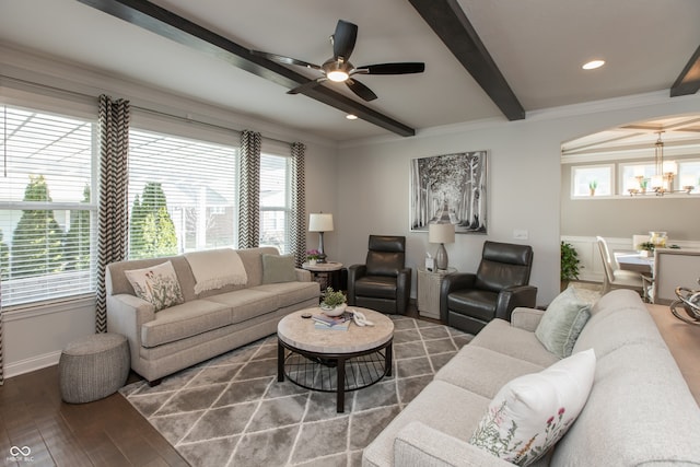 living room featuring beamed ceiling, ceiling fan with notable chandelier, wood finished floors, recessed lighting, and baseboards