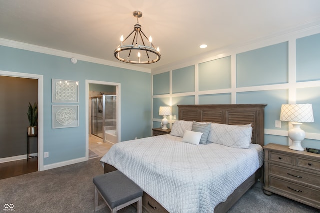 carpeted bedroom with crown molding, baseboards, a chandelier, a decorative wall, and ensuite bath