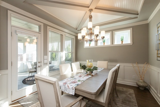 dining area with wood finished floors, a wainscoted wall, an inviting chandelier, beam ceiling, and a decorative wall