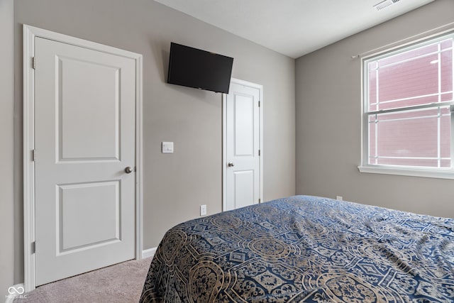 carpeted bedroom with visible vents