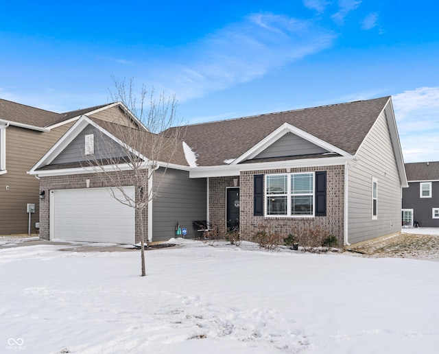 view of front of property featuring a garage and brick siding