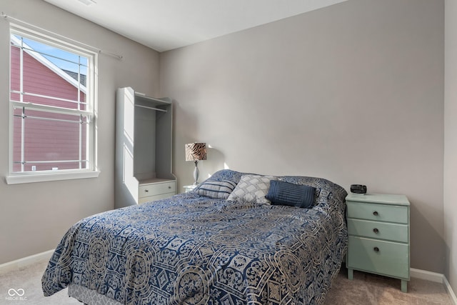 carpeted bedroom with baseboards