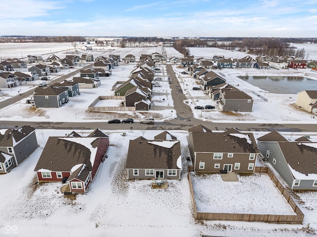 snowy aerial view with a residential view