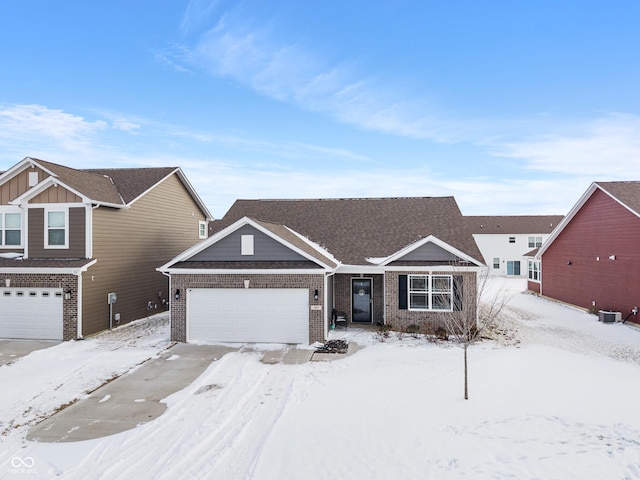 view of front of house with a garage and brick siding