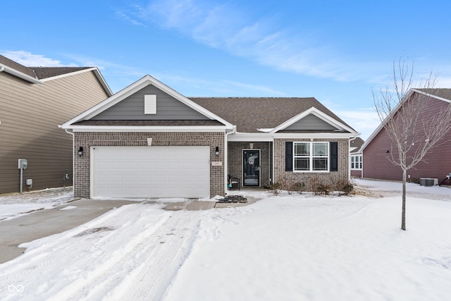 ranch-style home with brick siding, an attached garage, and cooling unit