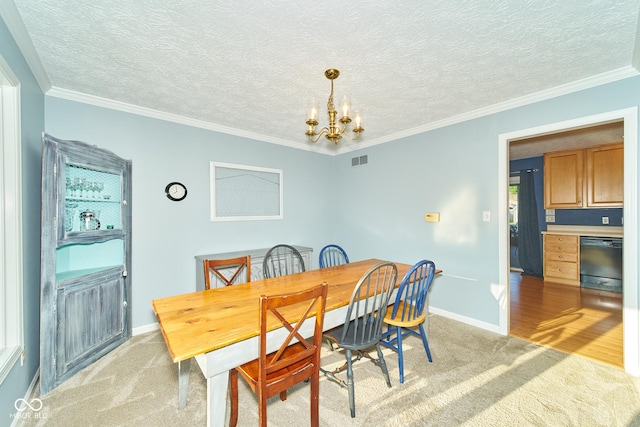 dining room with visible vents, a notable chandelier, light carpet, and baseboards