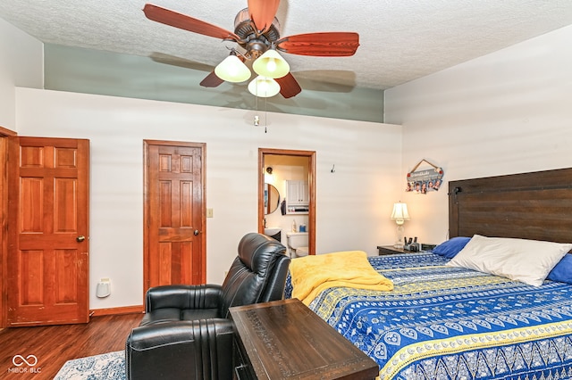 bedroom featuring dark hardwood / wood-style flooring, ceiling fan, a textured ceiling, and ensuite bathroom