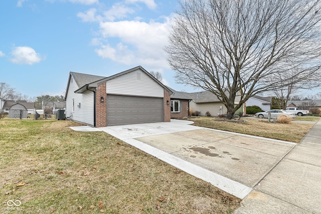 single story home featuring a front lawn, cooling unit, and a garage