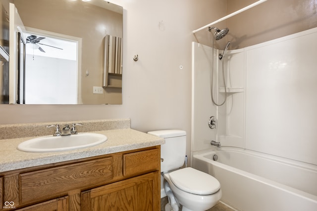 bathroom featuring toilet, vanity, shower / bath combination, and ceiling fan