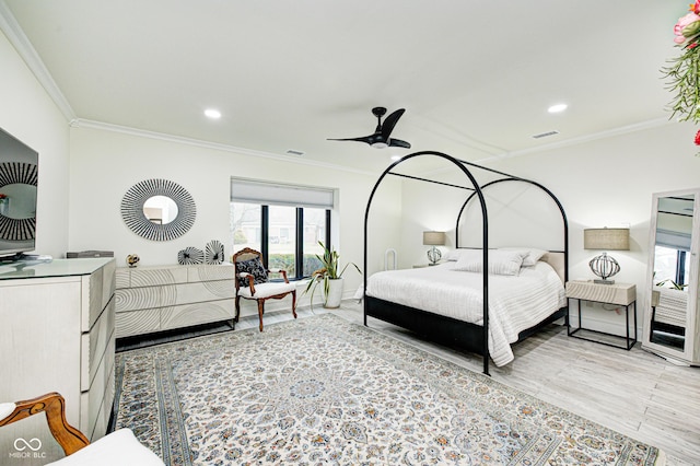 bedroom featuring ornamental molding, wood finished floors, and recessed lighting