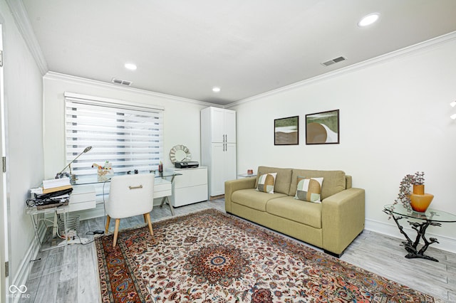 home office featuring ornamental molding, visible vents, light wood-style flooring, and baseboards