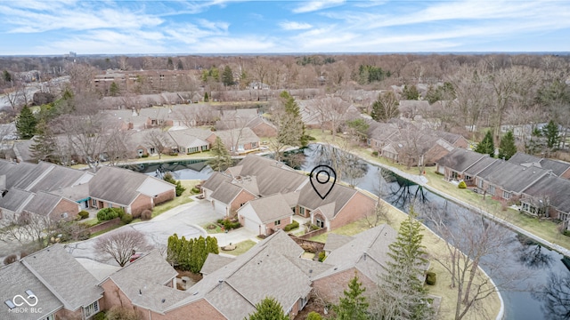 drone / aerial view featuring a water view and a residential view