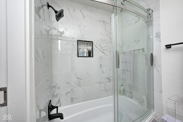 full bathroom featuring bath / shower combo with glass door