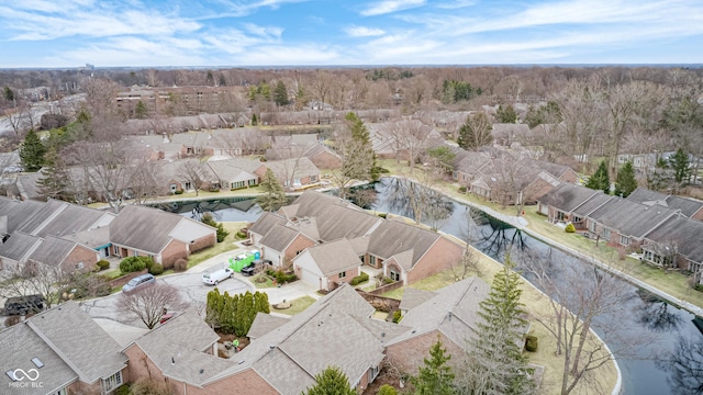 birds eye view of property with a water view and a residential view