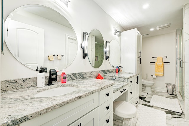 bathroom with marble finish floor, double vanity, toilet, a sink, and a shower stall