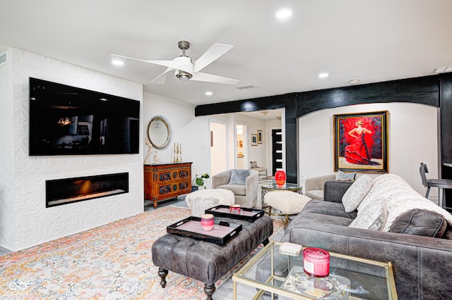 living room with recessed lighting, a large fireplace, visible vents, and ceiling fan