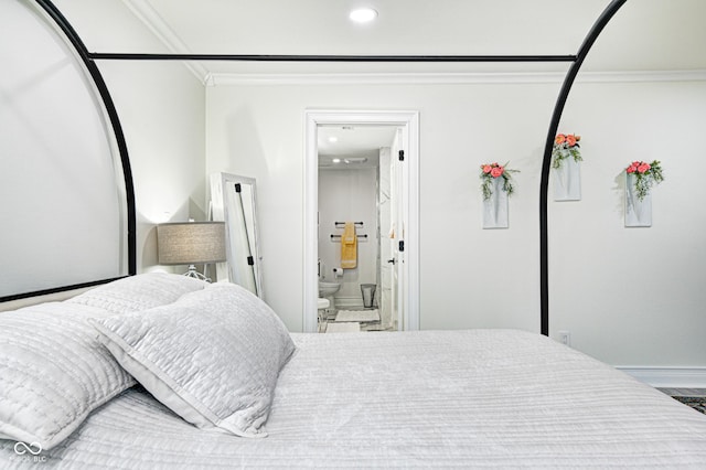 bedroom with ornamental molding, connected bathroom, and recessed lighting