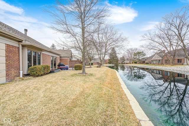 view of yard with a water view