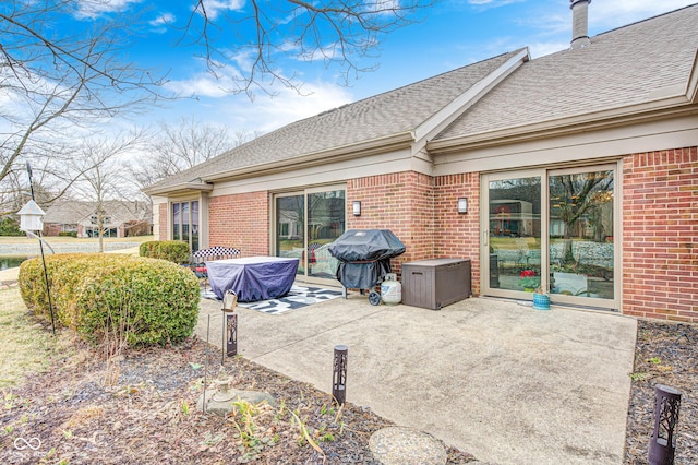 view of patio featuring a grill