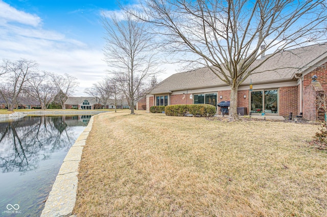 view of yard with a water view