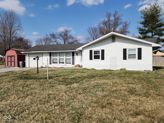 ranch-style house with aphalt driveway, fence, a shed, a front yard, and an attached garage