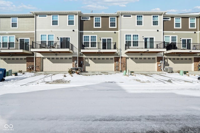 snow covered house with central air condition unit