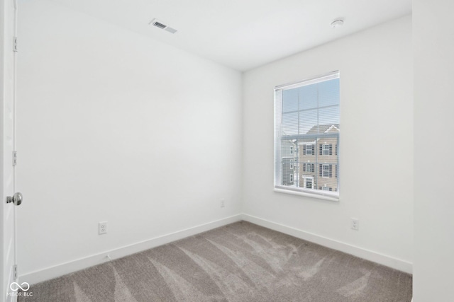 empty room with carpet flooring