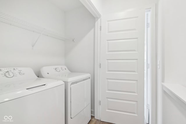 laundry room with separate washer and dryer