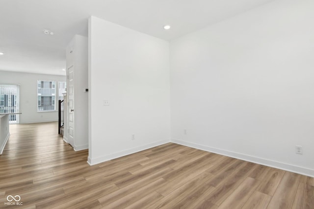 spare room with light wood-type flooring