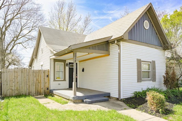 2014 Barth Ave, Indianapolis, IN 46203 - view of front of house with fence, roof with shingles, and board and batten siding