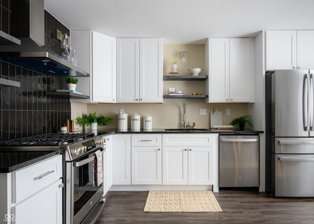 kitchen featuring stainless steel appliances, dark countertops, and open shelves