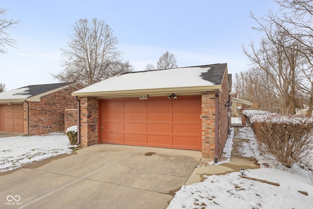 view of snow covered garage