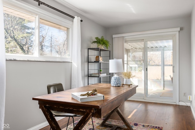 office area with baseboards and wood finished floors