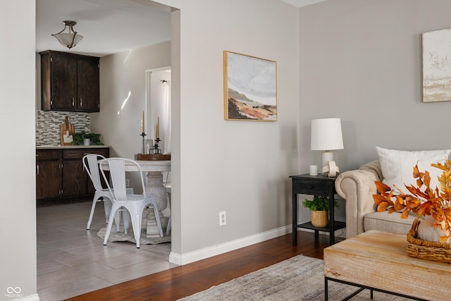 living room featuring baseboards and wood finished floors