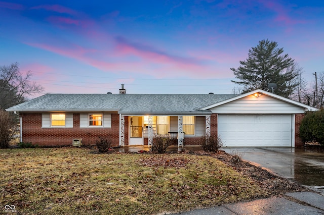 ranch-style house with an attached garage, roof with shingles, concrete driveway, and brick siding