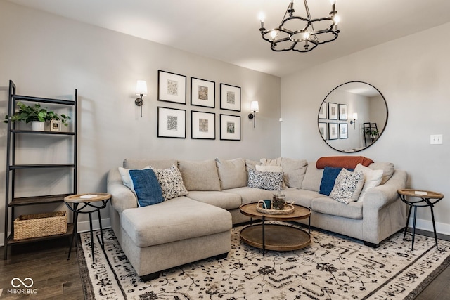 living room featuring a chandelier, wood finished floors, and baseboards