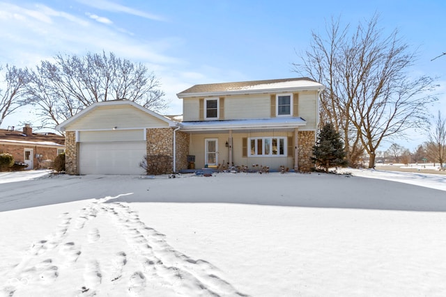 traditional home with a garage, stone siding, and covered porch