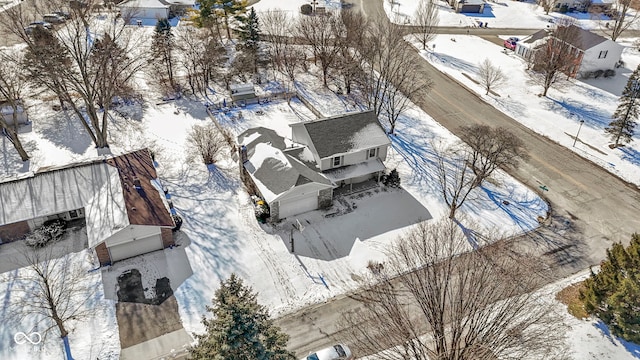 snowy aerial view featuring a residential view