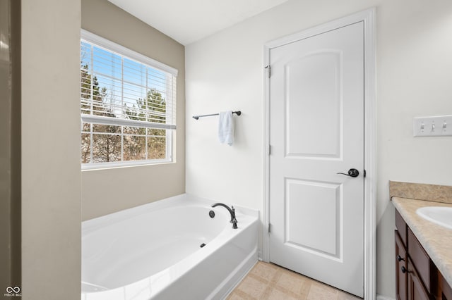 bathroom featuring vanity and a bathtub