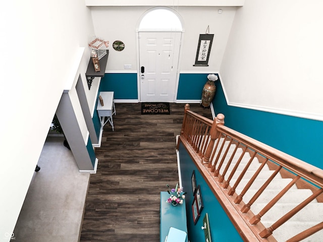 staircase with wood-type flooring