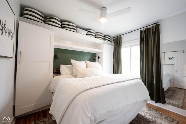 bedroom featuring hardwood / wood-style flooring and ceiling fan