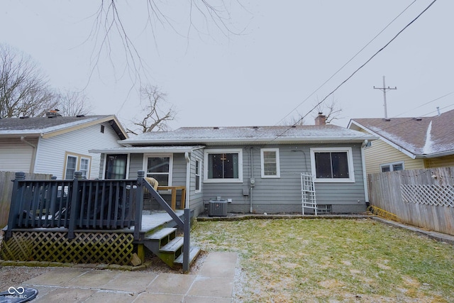 back of house featuring a deck, a yard, and cooling unit