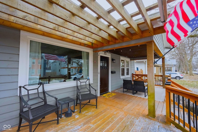 wooden deck featuring a pergola