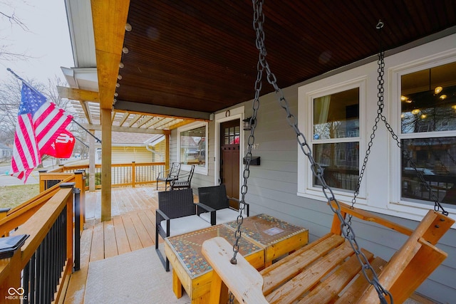 wooden terrace with a porch