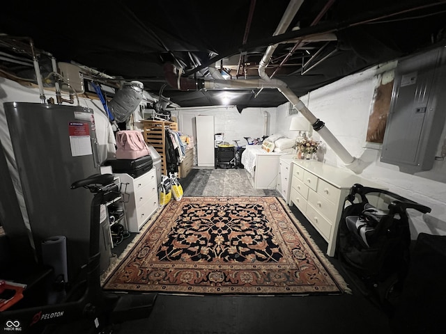 basement with electric panel, water heater, and washing machine and clothes dryer