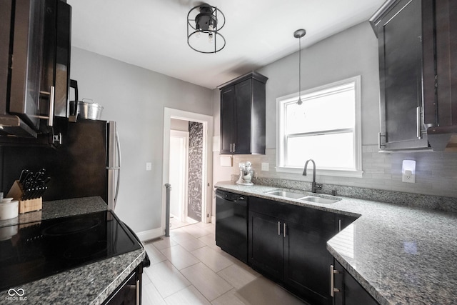 kitchen with dark stone countertops, sink, black dishwasher, range with electric cooktop, and hanging light fixtures