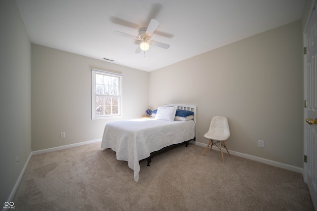 carpeted bedroom featuring visible vents, baseboards, and ceiling fan