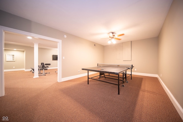 rec room featuring light carpet, ceiling fan, and baseboards