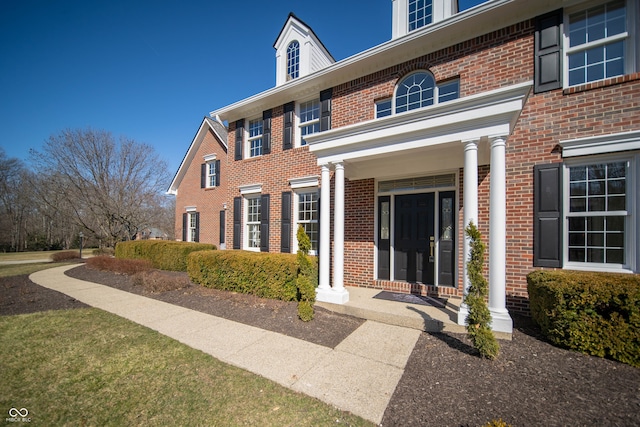 entrance to property with brick siding