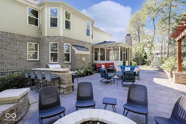 view of patio / terrace featuring an outdoor hangout area, exterior bar, and a sunroom